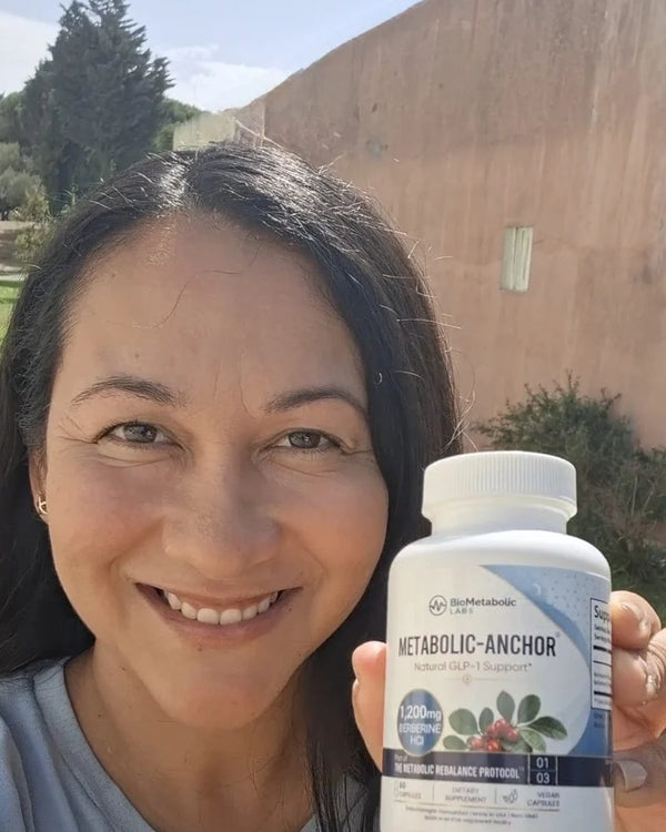 Amanda M. holding a bottle of Metabolic-Anchor