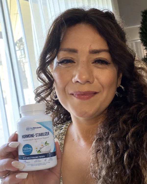 Fatima S. holding a bottle of Hormone-Stabilizer
